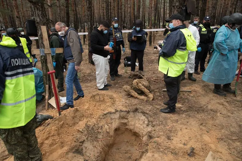 The forest burial site in Izium on the first day of the exhumation