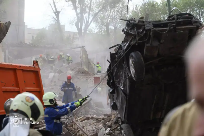 Rescue and clean-up work at the site of a destroyed apartment building in Kyiv