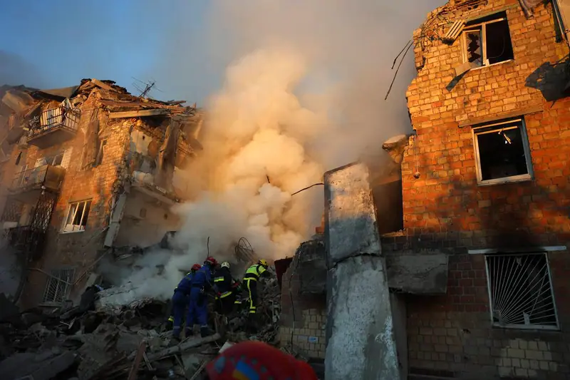 A collapsed apartment building in Kyiv after the attack